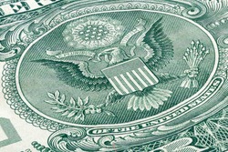 Symbols of victory and courage, currency of the United States of America and mysterious symbolism concept with macro close up photograph of the eagle on a US 1 dollar bill