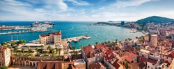 Panoramic summer cityscape of old medieval city - Split, Croatia, Europe. Sunny morning seascape of Adriatic sea. Beautiful world of Mediterranean countries. Traveling concept background.