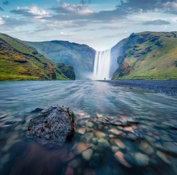 Gloomy morning view of Skogafoss Waterfall. Splendid summer landscape of Skoga river. Moody outdoor scene of Iceland, Europe. Beauty of nature concept background.