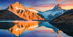 Awesome evening panorama of Bachalp lake (Bachalpsee), Switzerland. Unbelievable autumn sunset in Swiss Alps, Grindelwald, Bernese Oberland, Europe. Beauty of nature concept background.