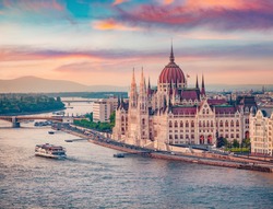 Amazing evening view of Parliament house. Stunning spring cityscape of Budapest. Great sunset in Hungary, Europe. Traveling concept background.