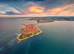 View from flying drone of old town of Nessebar. Spectacular spring seascape of Black sea. Amazing sunrise in Bulgaria, Europe. Traveling concept background.