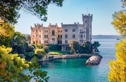 Beautiful summer view of Miramare Castle. Adorable  morning seascape of Adriatic sea. Spectacular outdoor scene of Italy, Europe. Traveling concept background.