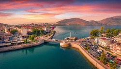 Splendid summer view from flying drone of Chalcis town with Chalkida's Old Bridge, Greece, Europe. Spectacular sunrise on Euboea island, Greece, Europe. Traveling concept background.