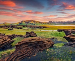 Unbelievable Icelandic landscape on the south coast of Iceland on Atlantic coast. Spectacular summer sunset with volcanic ground. Beauty of nature concept background.