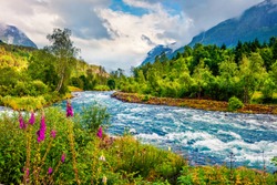 Dramatic summer view of Loelva river, located near Loen village, municipality of Stryn, Sogn og Fjordane county, Norway. Colorful sunny scene in Norway. Beauty of nature concept background.