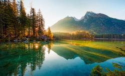 Wonderful autumn sunrise of Hintersee lake. Amazing morning view of Bavarian Alps on the Austrian border, Germany, Europe. Beauty of nature concept background.