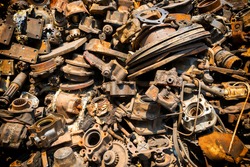 Pile of old rusty metal scrap, used machine spares and car parts can be used as mechanic industrial background