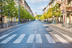 City street with empty crossroad,  road and morning light in Europe, Lithuania, Vilnius
