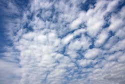 Formation of white clouds over blue sky