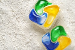 Dishwasher detergent tablets and powder. Choice concept. Copy space