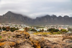 residential suburbia cape town near the Table Mountain, fogy mountain tips