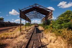 vintage run down decommissioned train depot and rail tracks