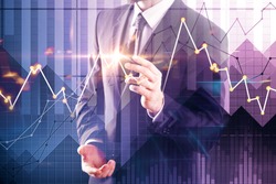 Young businessman drawing creative forex chart on abstract blurry background. Stock market and investment concept. Double exposure 
