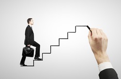 businessman walking on drawing stairs