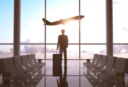 businessman in airport and airplane in sky
