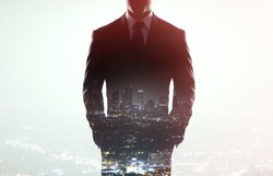 businessman in coat on a city background