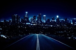 Road leading to modern illuminated night city. Forward concept