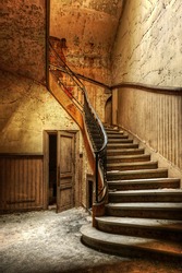 Decaying staircase in an abandoned central office