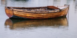 Solitary wooden rowing boat