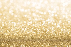 Gold defocused glitter background with copy space