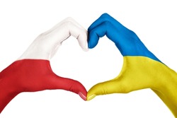 Human hands, painted with Poland and Ukraine flags,  forming heart shape isolated on white background