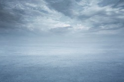 Empty nature background, frozen lake with dramatic sky