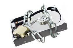 Chain and lock around a opened hard drive depicting information security