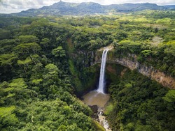 Aerial top view perspective of Chamarel Waterfall in the tropical island jungle of Mauritius