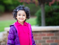 Outdoor Portrait of a Smiling Toddler Girl