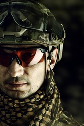 close up portrait of handsome military man. Macro shot on black background