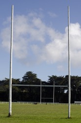 Goalposts in empty football rugby goal field. The game is very popular in commonwealth countries. No people. Copy space