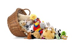 Stuffed animal toys in a basket, isolated on a white background 