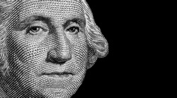 Close up first USA president George Washington on one Dollar bancnote isolated on black background. Economy, finances and business of America concept.