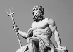 Ancient stone statue of mighty god of the sea and oceans Neptune (Poseidon) with trident. Black and white image.