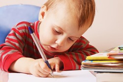 little baby girl learns to write (development, training, education)