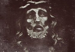 Retro and  dirty styled image of antique statue of Jesus Christ face. (Religion, vintage, faith, history, suffering concept)