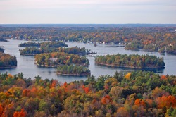 Aerial view of Thousand Islands National Park on St. Lawrence River in fall, from Sky deck on Hill Island, on the border of Ontario in Canada and New York State in USA.