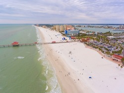 Clearwater Beach and Pier 60 Fishing Pier aerial view in a cloudy day, city of Clearwater, Florida FL, USA. 