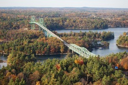 International bridge between USA and Canada in Thousand Islands Region in fall, New York State, USA