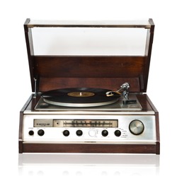 Vintage record player with radio tuner isolated on white background