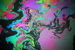 Abstract colorful rainbow oil slick on water background