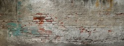 Old brick wall banner. Painted Distressed Wall Surface. Grungy texture. Grunge wall background. Building facade with damaged plaster.