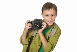 Smiling teenage boy with camera on white