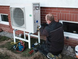 The installer installs the heat pump in a single-family house