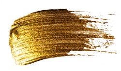 Creative brushstrokes of gold paint isolated on a white background. Gold paint texture. Smears of cosmetics, blush, highlighter, eye shadow, lipstick.