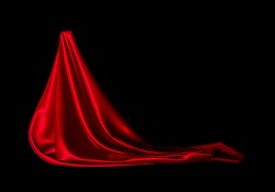 Satin red fabric on a black background. Abstract design.