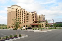                       A picture of a newly completed Hotel with empty lot