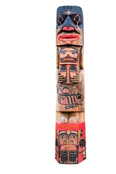 Totem pole with various tribal faces isolated on white background