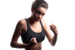 Sports girl, studio shot. isolated over white background.Sexy young and fit female fighter posing in combat poses 